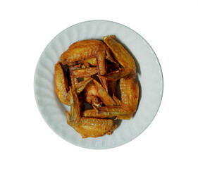 Fried chicken wings in white plate on white background