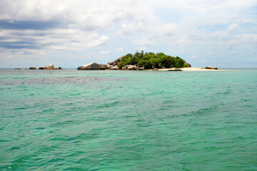 Colorful boats and sandy beaches in Belitung, Indonesia.