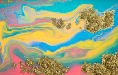 Fototapeta na wymiar Colorful bright abstract marble pattern with golden powder scattering.
