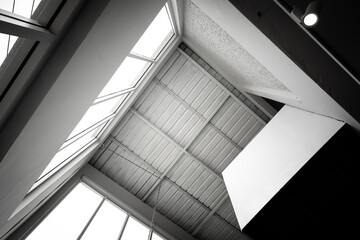 Interior of duplex office building with 2nd chamber overhead room in square composition. Photo in black-white tone.