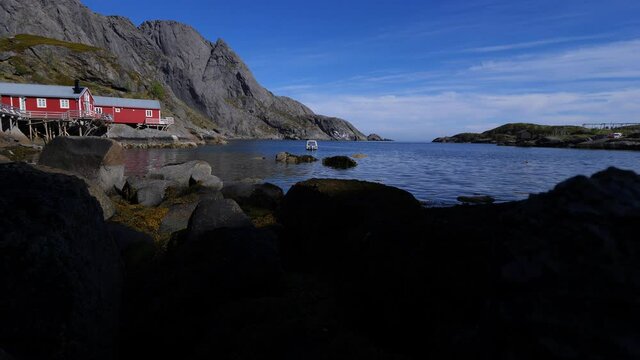 Video plans from right to left, nature, sea, mountains, boats. Suitable for documentaries, travel television programs.