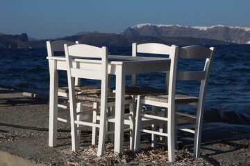 Table on the pier in Santorini island, Greece