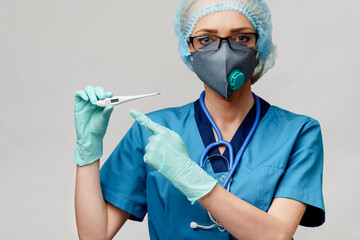 female doctor with stethoscope wearing protective mask and latex gloves over light grey background...