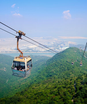Skyline cable car with green mountains and ocean landscape background