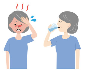 水分補給をする高齢女性　熱中症