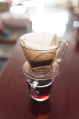 Instant freshly brewed cup of coffee or paper dripping bag on a cup.
