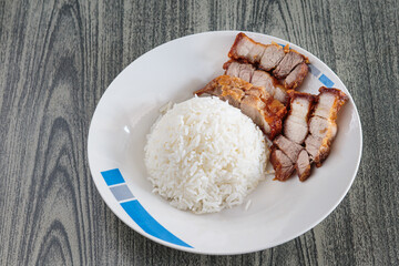 Three layers of crispy pork with rice.