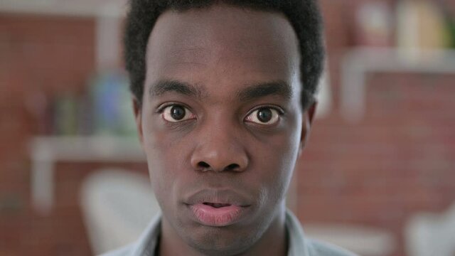 Close up of African Man feeing Shocked at the Camera 