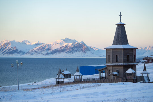 Russian church with snow covered landscape in an old mining town called "Barentsburg" on Spitsbergen.
