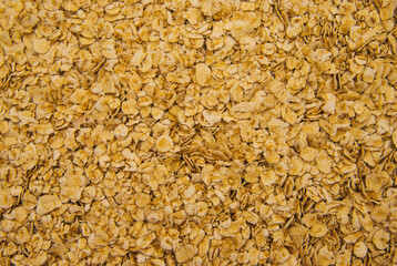 Oatmeal flakes scattered on a white background. Dietary food. Healthy breakfast.Texture and background.