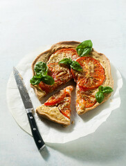 summer vegan pie galette with tomatoes and tofu in oat milk. tasty snack or healthy food lunch