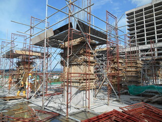 MALACCA, MALAYSIA -SEPTEMBER 19, 2016: Column timber form work and reinforcement bar at the construction site in Malacca, Malaysia. The structure supported by temporary wood support