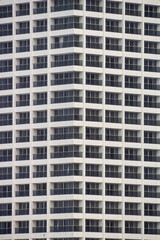 black glass windows in a white building in Rio de Janeiro.
