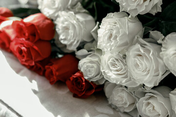 red and white roses on the table. close-up