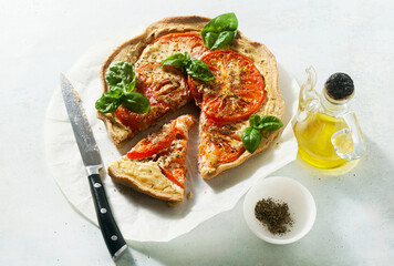 summer vegan pie galette with tomatoes and tofu in oat milk. tasty snack or healthy food lunch