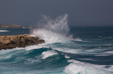 Wave smashing against a pier