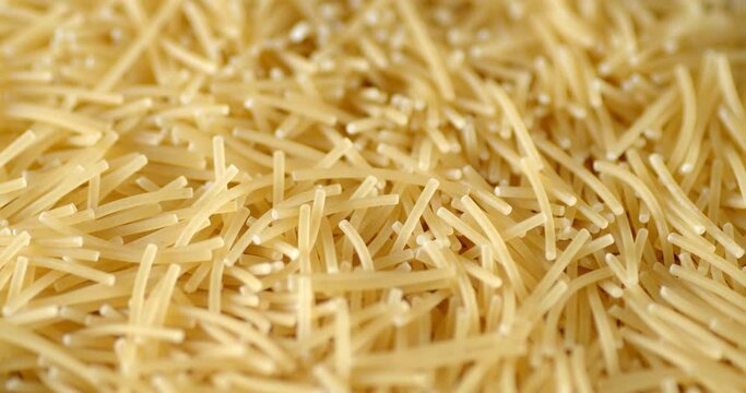Italian vermicelli pasta dry slowly rotates.