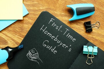 Financial concept meaning First-Time Homebuyer's Guide with phrase on the sheet.