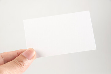 Hand hold white blank card