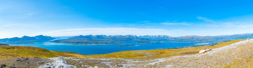 Fototapeta na wymiar Aerial view of the mountains and hills around Tromso and Tromsoysundet strait in Norway