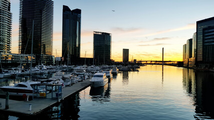 Fototapeta na wymiar Pier area of Melbourne city at sunset