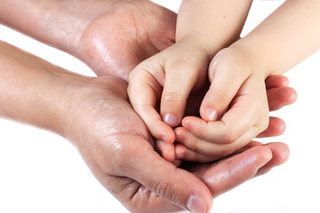 Caucasian child's hand on brunette mother's hand on isolated white background. Love between child and mother. Mothers day concept.