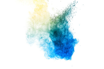 Explosion of blue and yellow dust on white background.