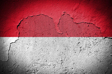 Indonesia flag on cracked wall
