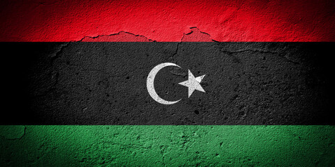 Libya flag on cracked wall - obrazy, fototapety, plakaty
