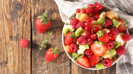 fresh fruit salad with berry fruit, banana and kiwi