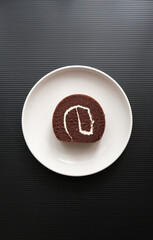 Chocolate Swiss Roll on a plate