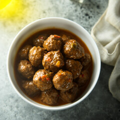 Homemade meatballs in a white bowl