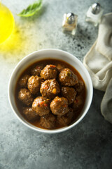 Homemade meatballs in a white bowl