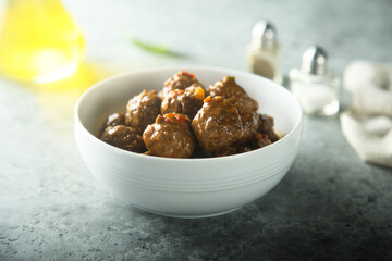 Homemade meatballs in a white bowl