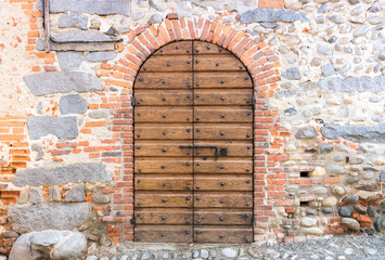 Original medieval wooden door; photo taken in Italy