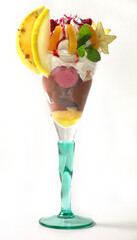 Fototapeta na wymiar Exotic fruits in a glass with ice cream.
