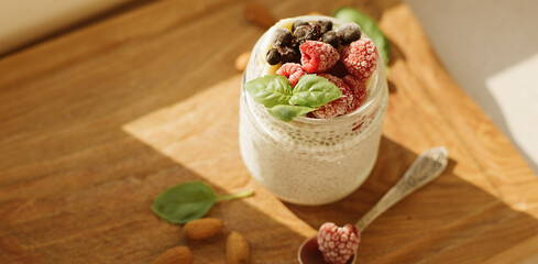 Vegan Chia Pudding with Frozen raspberry, Banana and almond on w