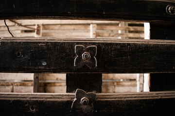 small woode flower nail on the old wooden beam close up vintage