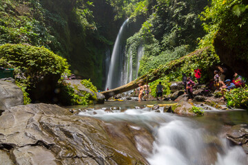 Tiu Kelep waterfall in Senaru, Lombok, Indonesia. Tourists from overseas were enjoying the waterfall.