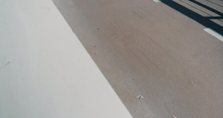 City cycling commuters on bike lane in European town. Cyclists on cruiser city bikes ride around on sunny summer day. Proper commuter friendly green infrastructure