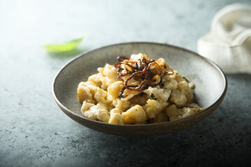 Traditional German noodles with cheese and fried onion