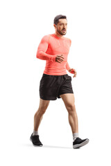 Fit young man in sportswear walking fast