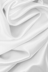 Smooth elegant white silk or satin luxury cloth texture as wedding background. Luxurious background design