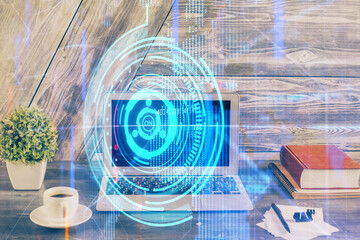 Double exposure of desktop computer and technology theme hologram. Concept of software development.