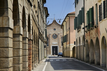 Via Carlo Alberto and church of Santa Maria Maggiore in Treviso. Veneto region. Italy