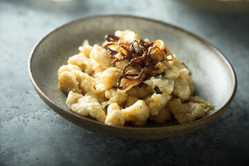 Traditional German noodles with cheese and fried onion