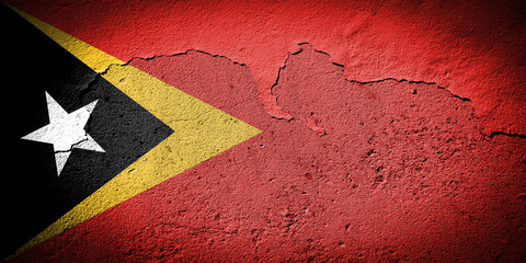 East Timor flag on cracked wall