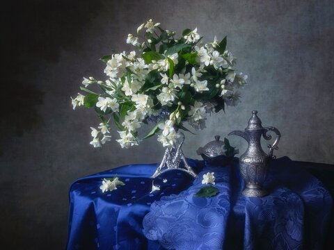 Still life with  white flowers in vintage vase
