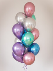 multicolored balloons on a light background. vertical orientation