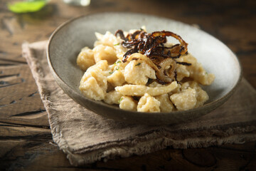Traditional German noodles with cheese and fried onion